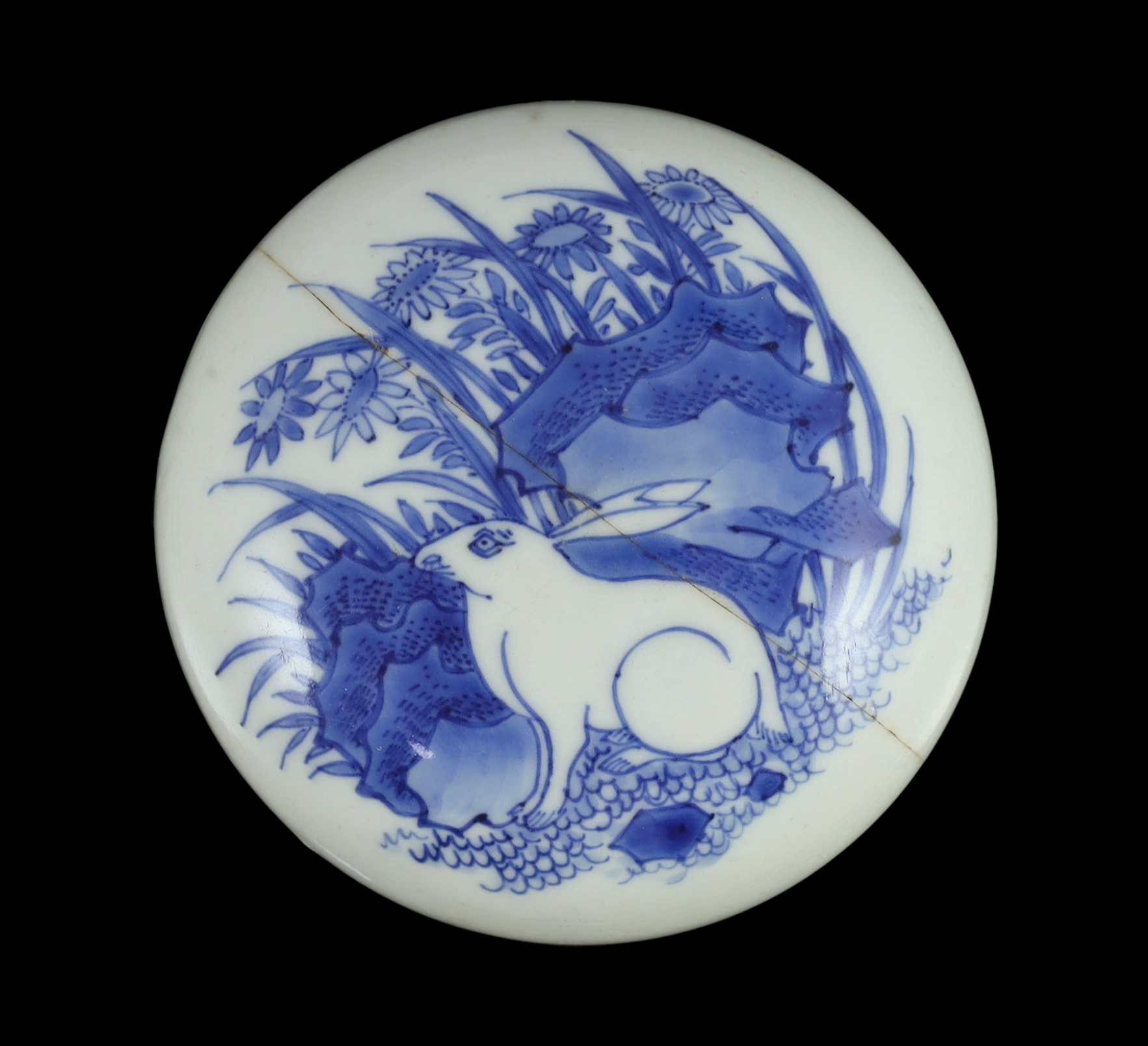 A Chinese Transitional blue and white ‘hare gazing at the moon’ cover, Chongzhen period (1627-1644), rivet repair